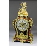 A French red tortoise-shell Boulle and gilt brass mounted mantel clock of Louis XV design, the