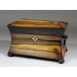 An early Victorian coromandel two division tea caddy with incurved sides and domed top, ebonised