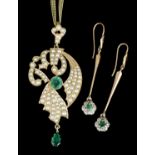 A modern gold coloured metal mounted emerald and seed pearl set pendant of scrolled form, set with a