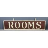 A 19th Century American cream and brown painted hanging sign with raised letters - "Rooms", 73ins