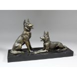 A 1920's French bronzed spelter group of seated and lying Alsations on a polished slate base, 20.