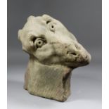 A 13th/14th Century carved limestone head of a camel with deeply drilled eyes, 12.5ins wide x 7.