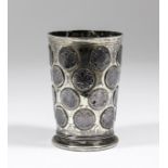 A 17th/18th Century Continental silvery metal beaker, the tapered bowl inset with four bands of