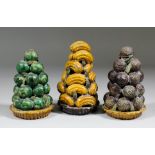 Three Chinese pottery "Grave" ornaments, each modelled in the form of various fruits, on moulded