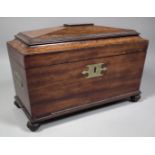 A William IV mahogany rectangular tea caddy of sarcophagus shape with split turned mouldings and