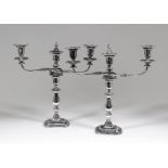 A pair of Elizabeth II three light candelabra of Neo-classical design with bead mounts to rim, plain