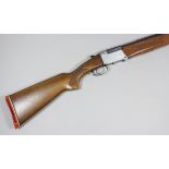 A 12 bore folding over and under shotgun by Investarm, Serial No. 325933, the 24.75ins blued steel