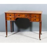 A Late Georian mahogany kneehole dressing table with moulded edge to top, fitted central frieze