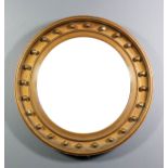 A 19th Century gilt framed circular convex wall mirror with 17ins diameter plate and moulded