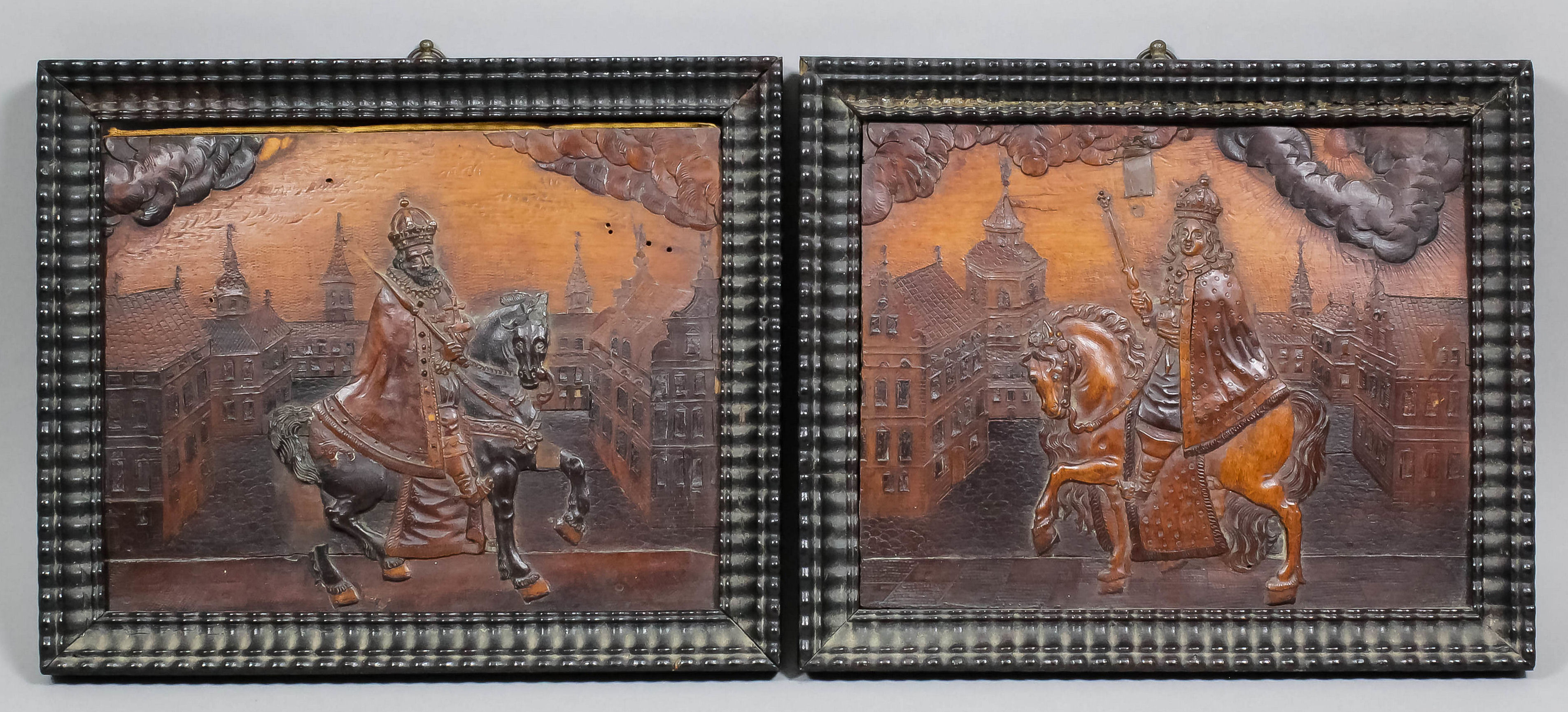 A fine pair of mid 17th Century Eger work panels, the various woods carved in low relief and