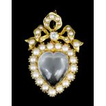 A late Victorian gold coloured metal mounted moonstone, pearl and diamond set heart pattern pendant,