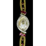 A modern lady's Leuba Louis 18ct gold mounted ruby and diamond set cocktail watch, the ovoid face