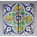 Four early 17th Century Dutch maiolica tiles creating a complete design with palmette corners,