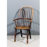 A 19th Century child's ash and beechwood two tier stick back Windsor armchair with high arched back,