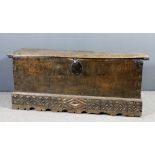 A 17th Century Spanish walnut cassonne with moulded edge to lid and carved and shaped apron, 60ins