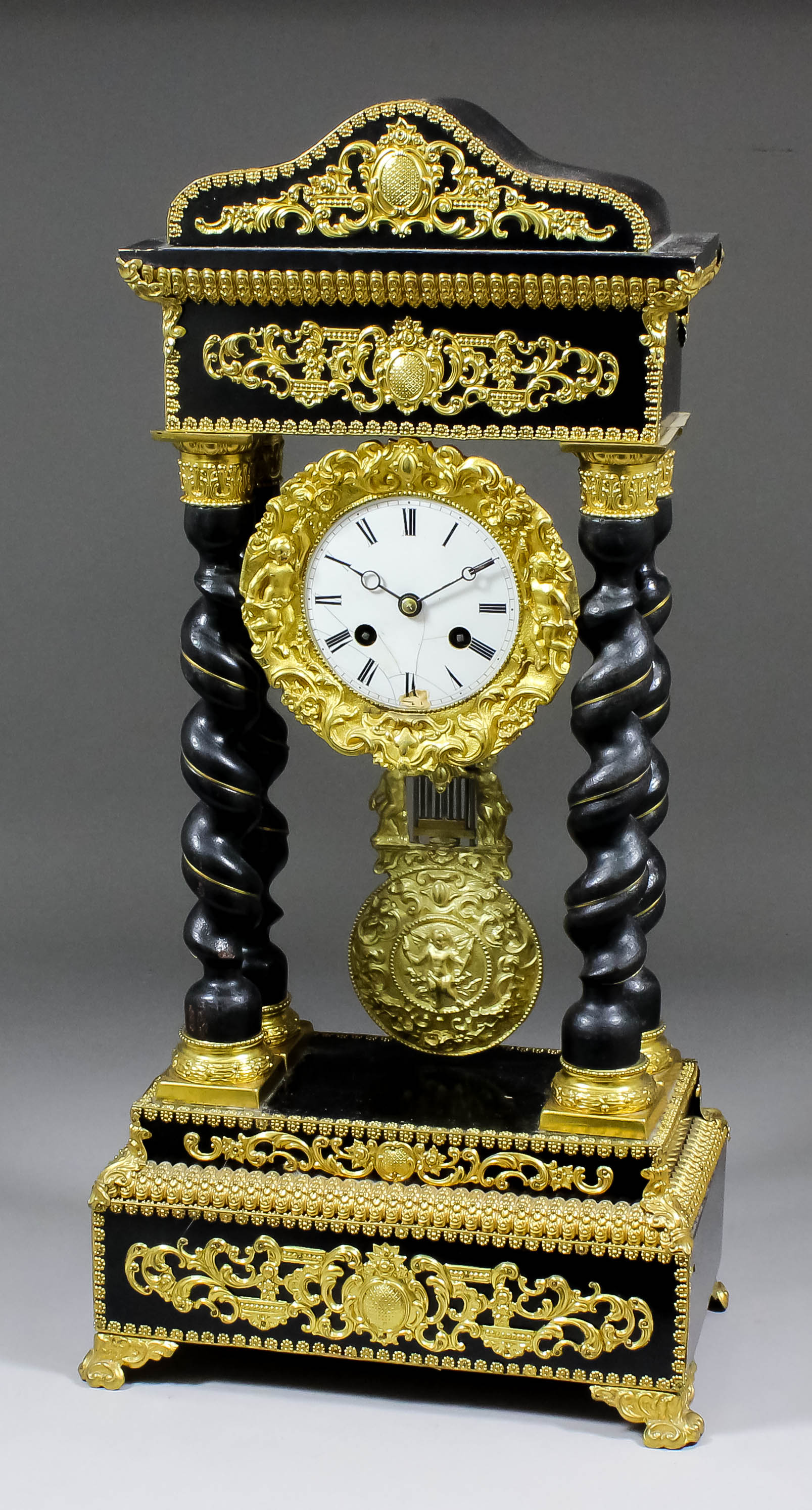 A 19th Century French ebonised and gilt metal mounted mantel clock of "Empire" design, the 3.5ins