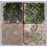 Four rare inscribed Medieval encaustic tiles each with a repeating design forming a quarter of a