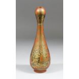 A Japanese "Shakudo" bronze slender baluster shaped vase with mottled gilded finish on a copper