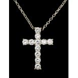 A modern silvery coloured metal mounted all diamond set cross pattern pendant, the face set with