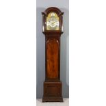 A George III mahogany longcase clock by John Smith of Lynn, the 12ins arched brass dial with wide