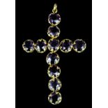 A late Victorian gold coloured metal mounted amethyst set cross pattern pendant, set with eleven