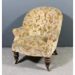 A Victorian spoon back easy chair, upholstered in floral cut dralon, the back buttoned, on