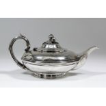 An early Victorian silver teapot, the squat circular body with moulded girdle and cast fruit and