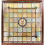 Five late Victorian stained glass window panels, the centres with circular panels, painted with