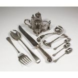 A Victorian silver four division cruet frame of quatrefoil pattern with three turned supports and