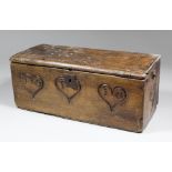 A 17th Century birchwood box, the sides deeply carved with heart shaped love tokens containing the