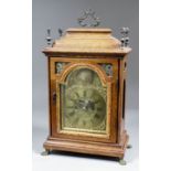 A late 19th Century oak cased mantel clock of early 18th Century design, the 5ins arched brass