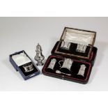 A late Victorian silver three piece condiment set of "Lighthouse" pattern, comprising - salt and