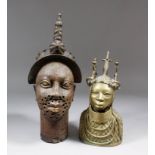 A Benin cast brass head of a male with scarification marks to his face and ornate headpiece, 16ins