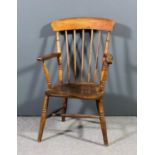 A 19th Century beechwood and elm seated stick back Windsor armchair on turned underframe, stamped "