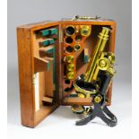 A late 19th Century J. Swift & Son, London, lacquered brass and black painted polarising microscope,