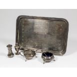 An early 20th Century silver rectangular tray with reeded and ribbon rim and engraved with scattered