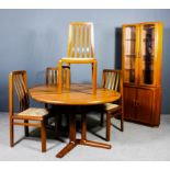 A modern Dynhund Danish teak circular extending dining table (with one extra leaf), on quadruple