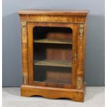 A Victorian walnut and gilt metal mounted dwarf display cabinet inlaid with stringings and