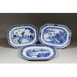 An 18th Century Chinese blue and white porcelain octagonal meat plate painted with a woman and boy