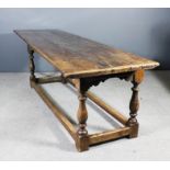 An old oak refectory table of "17th Century" design with cleated three plank top, on baluster turned