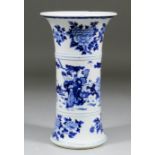 A Chinese blue and white porcelain vase of flared form, painted with figures in a landscape, and