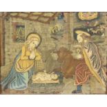 An early 16th Century Northern European needlework panel of the Nativity worked in coloured