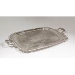 A plated rectangular two-handled tray of Georgian design, the centre engraved with C-scroll,