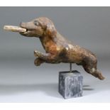 A 17th Century carved dog holding a loaf in its mouth, from a St. Roch group, Southern France, 16.