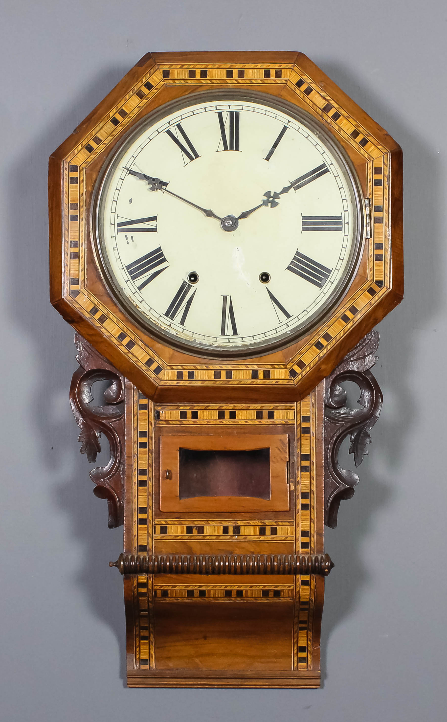 A late 19th Century American wall cased drop dial wall clock, the 12ins diameter painted metal