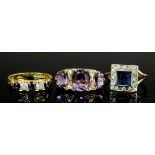 A modern 18ct gold mounted sapphire and diamond five stone ring, the central sapphire