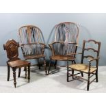 A 19th Century beechwood, ash and elm seated wheel back Windsor armchair with two tier stick back,