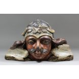 A fine and rare 17th Century English carved oak bust of a Saracen with much original polychrome,