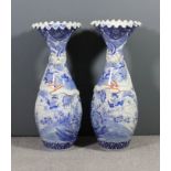A pair of late 19th/early 20th Century Japanese porcelain blue and white bottle shaped vases with