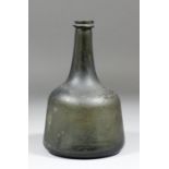 A mid 18th Century English glass mallet shaped wine bottle, 8.5ins high (circa 1740) Provenance :